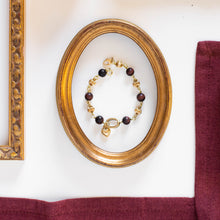 Load image into Gallery viewer, Bracciale CUORE con charm pendente a forma di cuore dorato, perle di occhio di tigre rosso satinato inframezzate da particolari perle dorate.
